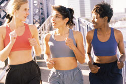 three women exercising in gym