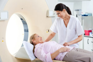 doctor comforting patient before CT scan
