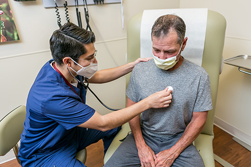 Urgent Care doctor treating a patient