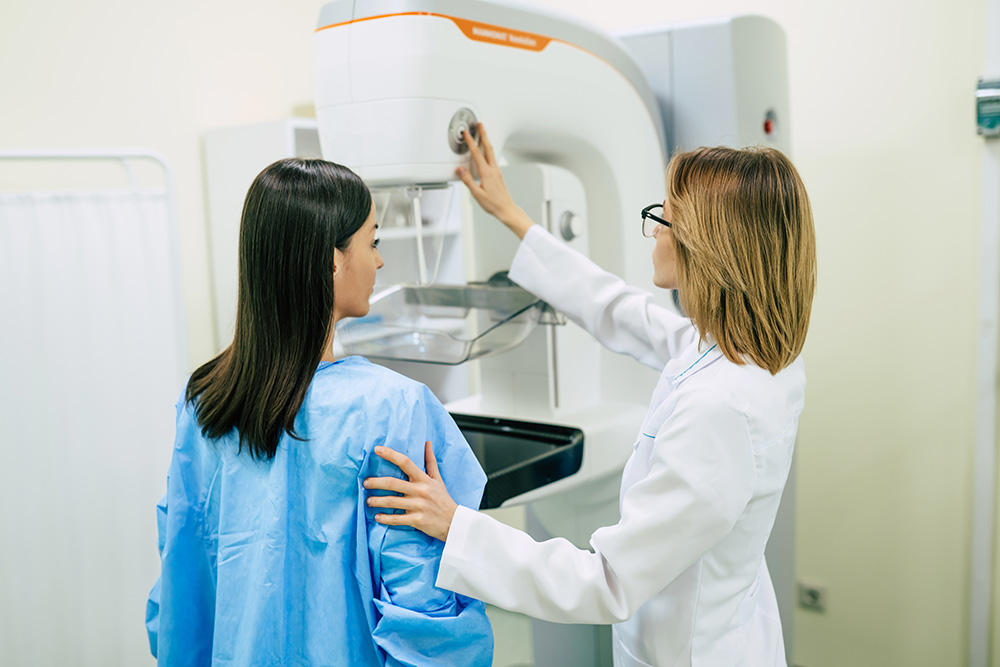 Woman having a screening mammogram at a medical clinic.